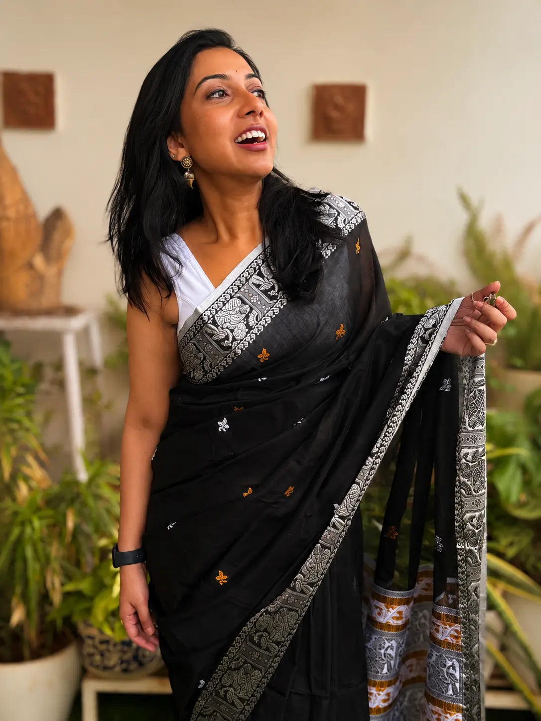Handwoven cotton Jamdani saree in black and silver with traditional motif