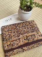 Dharalekha hand printed brown cotton Kalamkari saree with intricate traditional motifs in soft breathable cotton for office wear, festive occasions, and everyday elegance