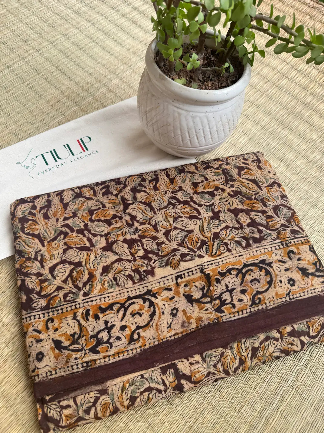 Dharalekha hand printed brown cotton Kalamkari saree with intricate traditional motifs in soft breathable cotton for office wear, festive occasions, and everyday elegance