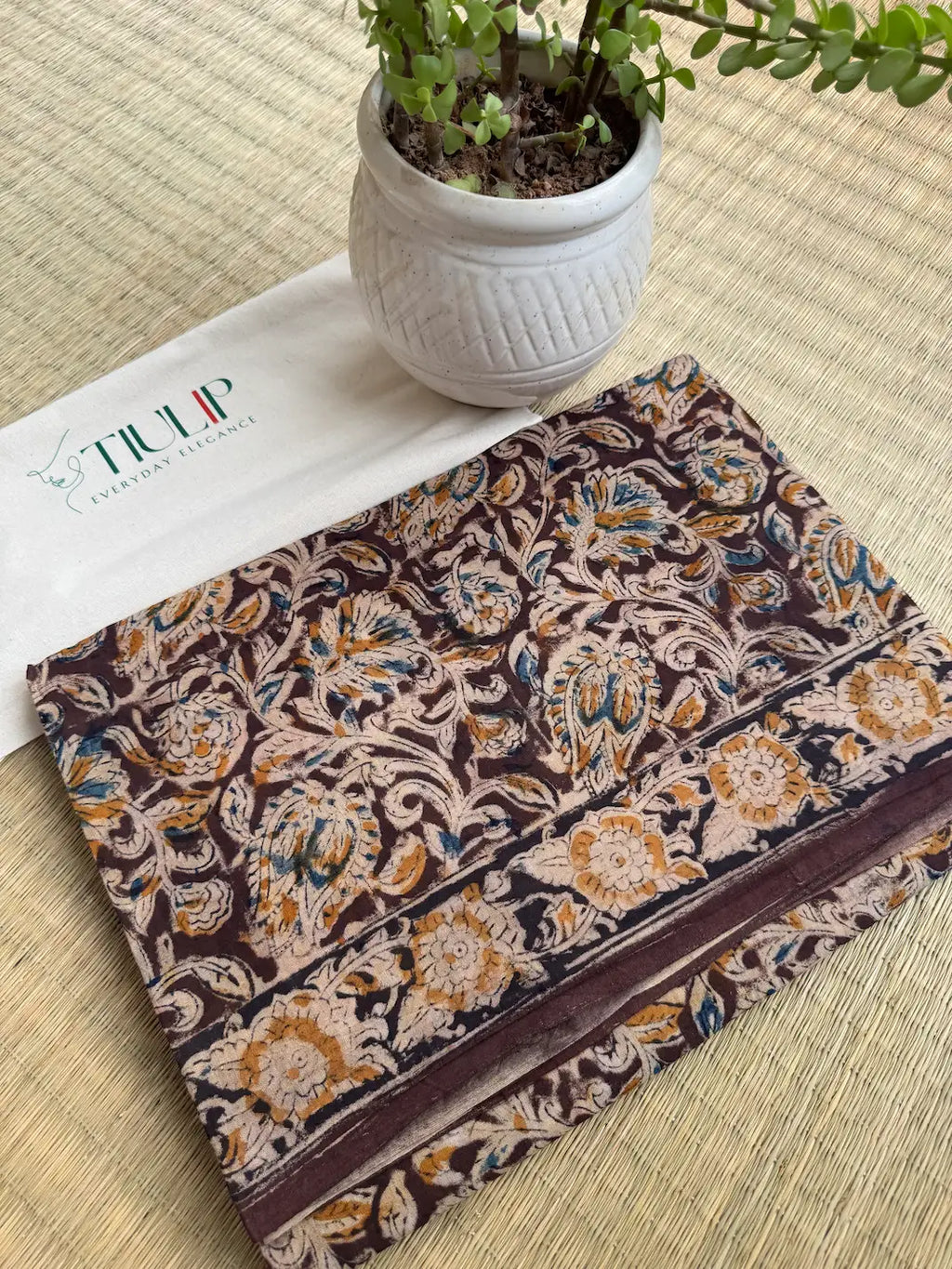 Mrinalekha hand printed brown cotton Kalamkari saree with intricate traditional motifs in soft breathable cotton for office wear, festive occasions, and everyday elegance