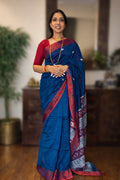 Handwoven cotton Jamdani saree in blue and red with traditional motifs