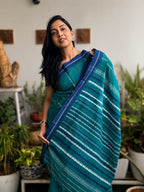 Sarayu pure handwoven bluish green Begampuri cotton saree in soft breathable cotton with traditional woven borders for office wear and everyday elegance