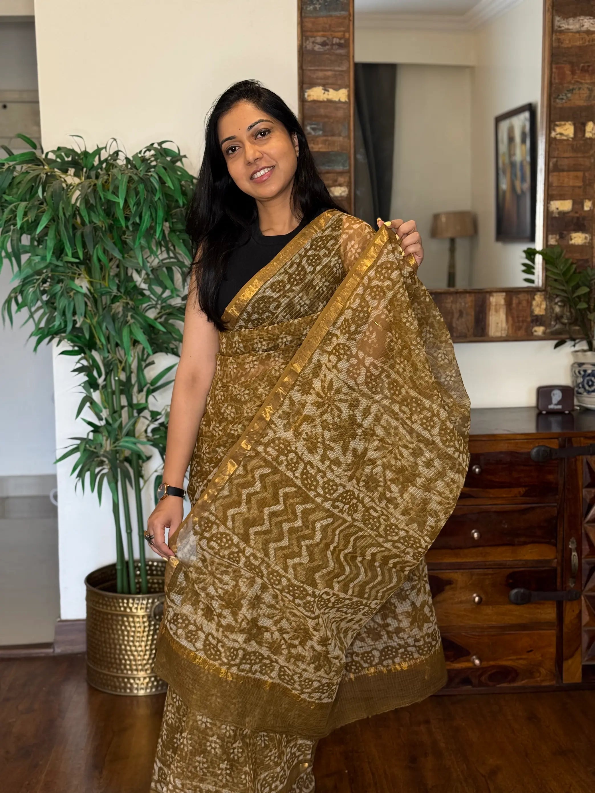 Yellow Kota Doria saree featuring lightweight traditional weave