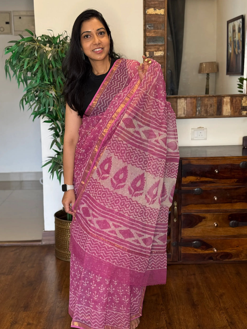 Pink handwoven Kota Doria saree with delicate woven patterns