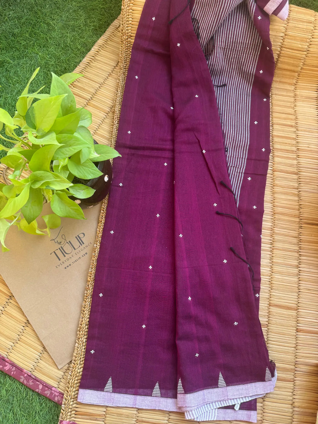 Purple handwoven cotton Jamdani saree with traditional woven patterns