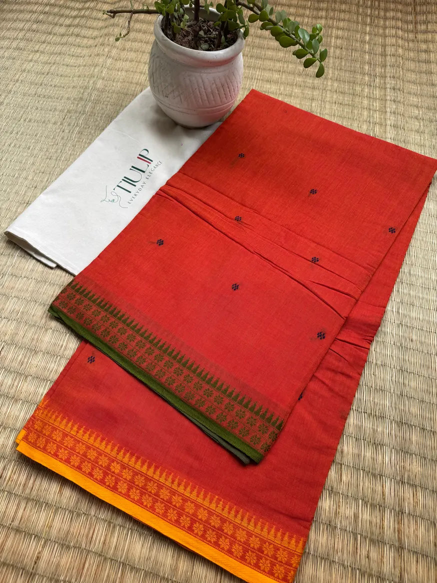 Ushasi orange handwoven Dhaniakhali cotton saree with contrasting dual-colour paar, traditionally woven in Bengal