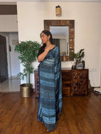 Woman wearing handwoven modal silk saree with elegant woven motifs