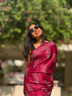 Woman wearing red handwoven modal silk saree with elegant woven motifs