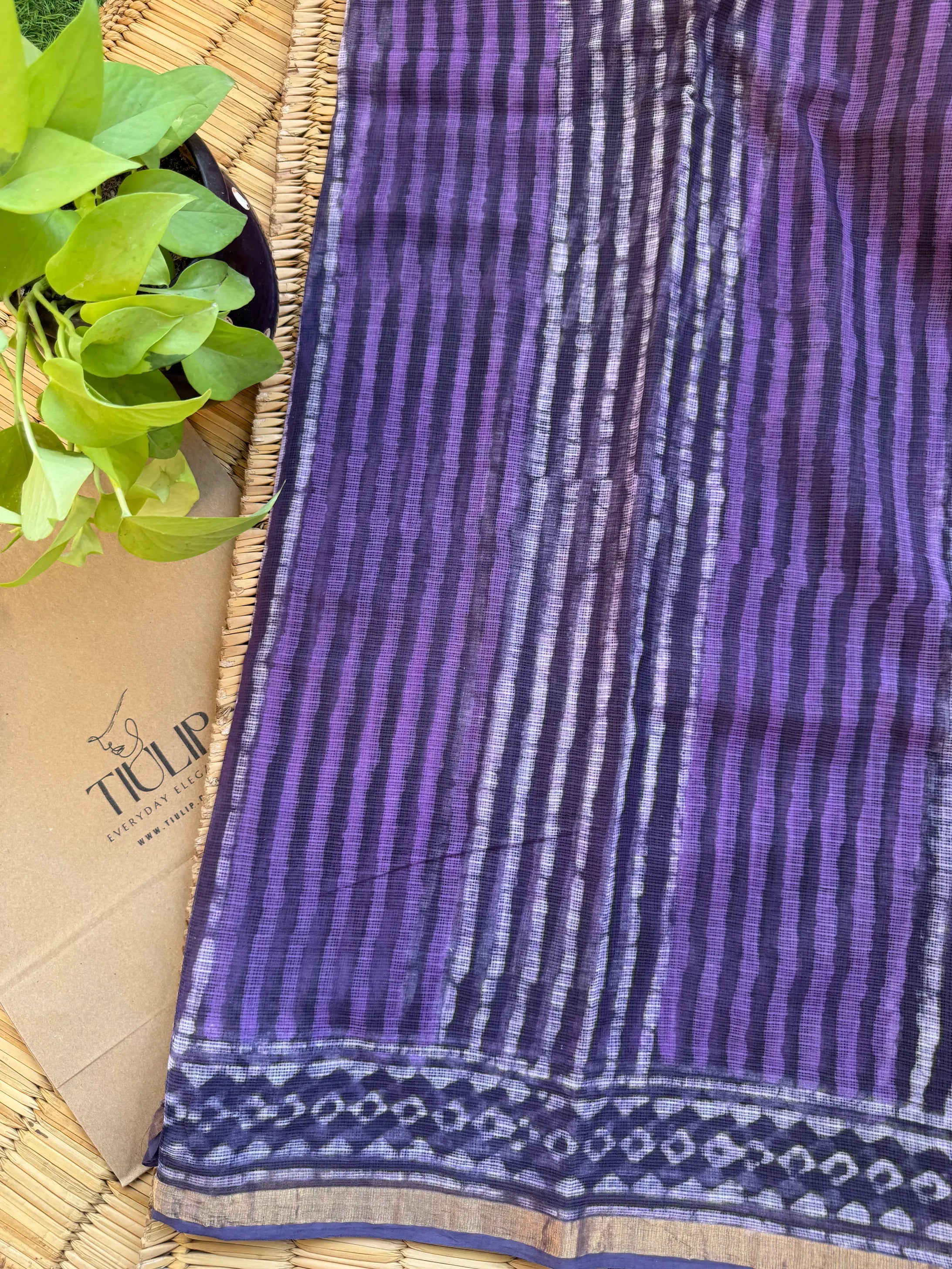 Purple handwoven Kota Doria saree with elegant woven motifs