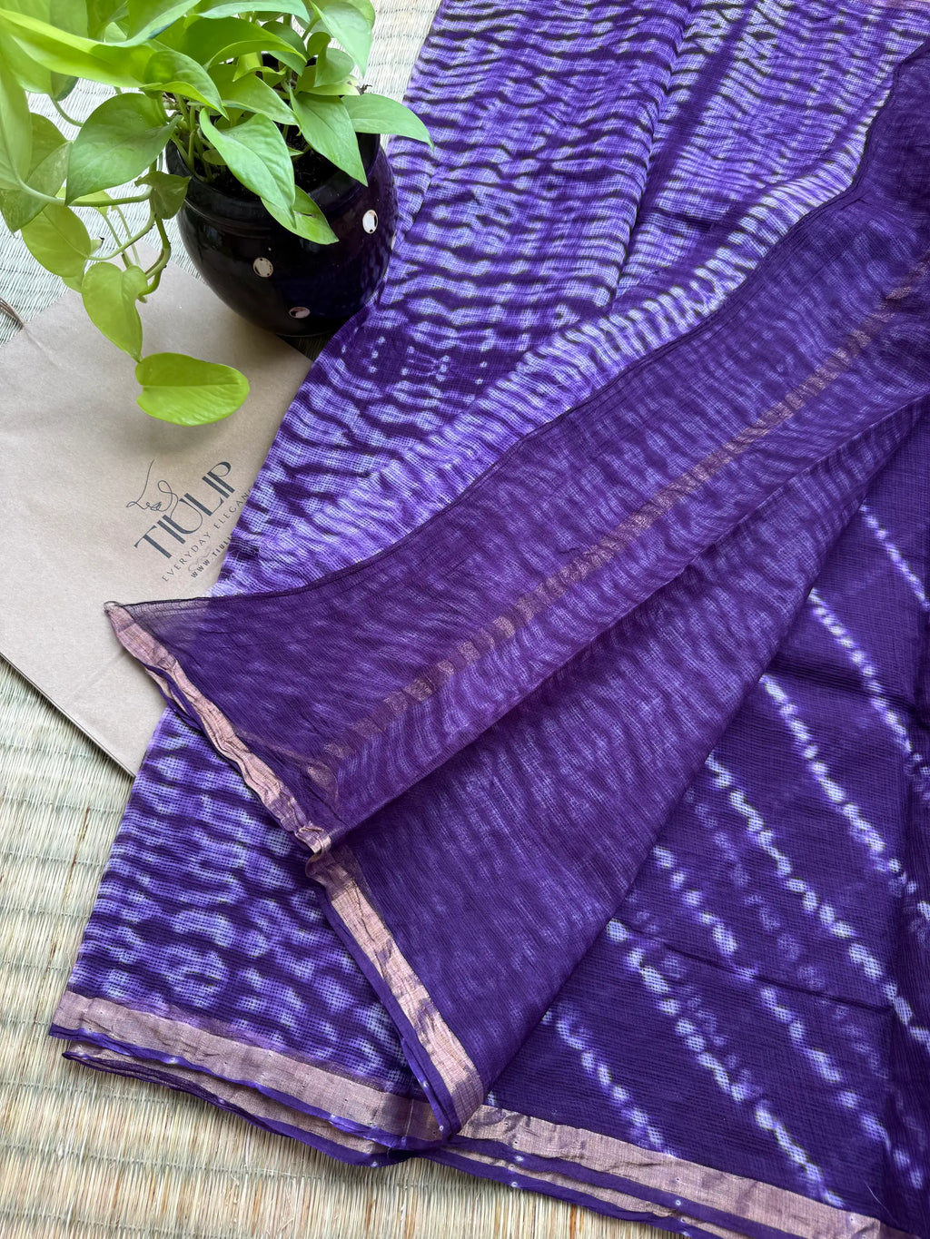 Purple handwoven Kota Doria saree with elegant woven motifs