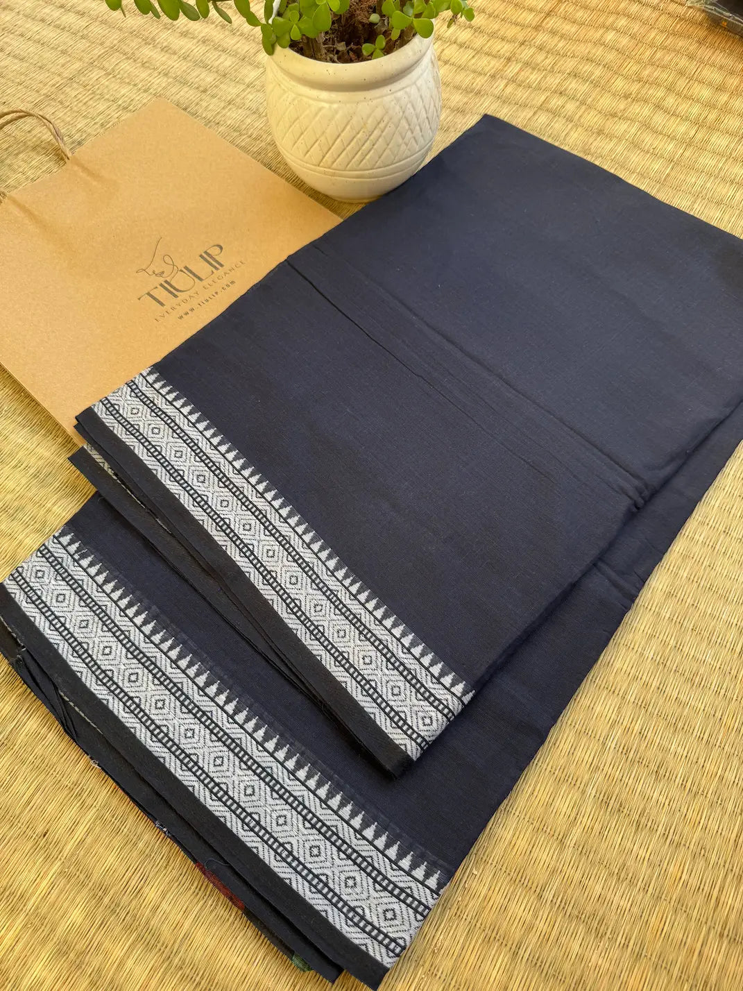 Nishigandha pure handwoven deep navy blue Dhaniakhali cotton saree in soft breathable cotton for office wear, festive mornings, and everyday elegance