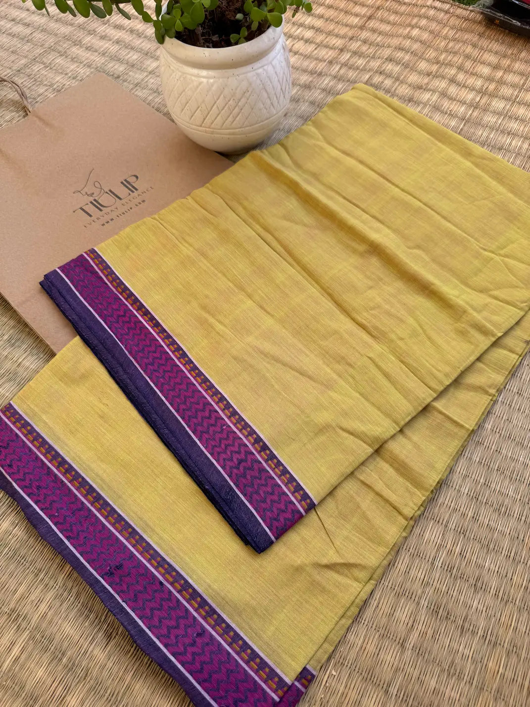 Kadambini pure handwoven yellow ochre Dhaniakhali cotton saree with purple border in soft breathable cotton for office wear, festive mornings, and everyday elegance