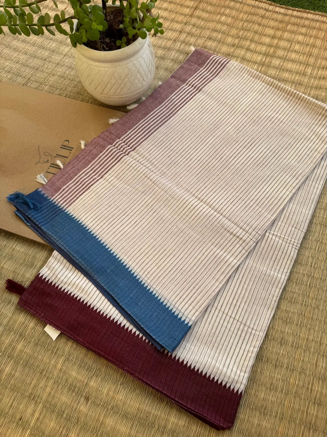 Aloka pure handwoven white Dhaniakhali cotton saree with red and blue vertical stripes in soft breathable cotton for office wear and everyday elegance