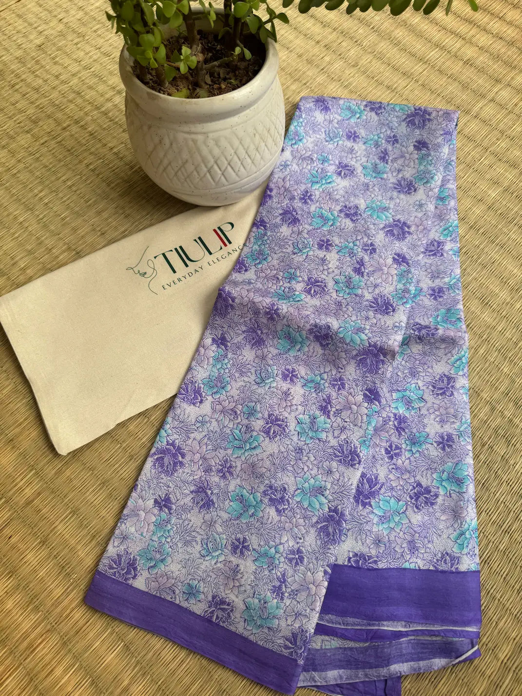 Rajnandini pure handwoven violet floral Murshidabad silk saree with a soft lustrous finish and elegant floral design for weddings and festive occasions
