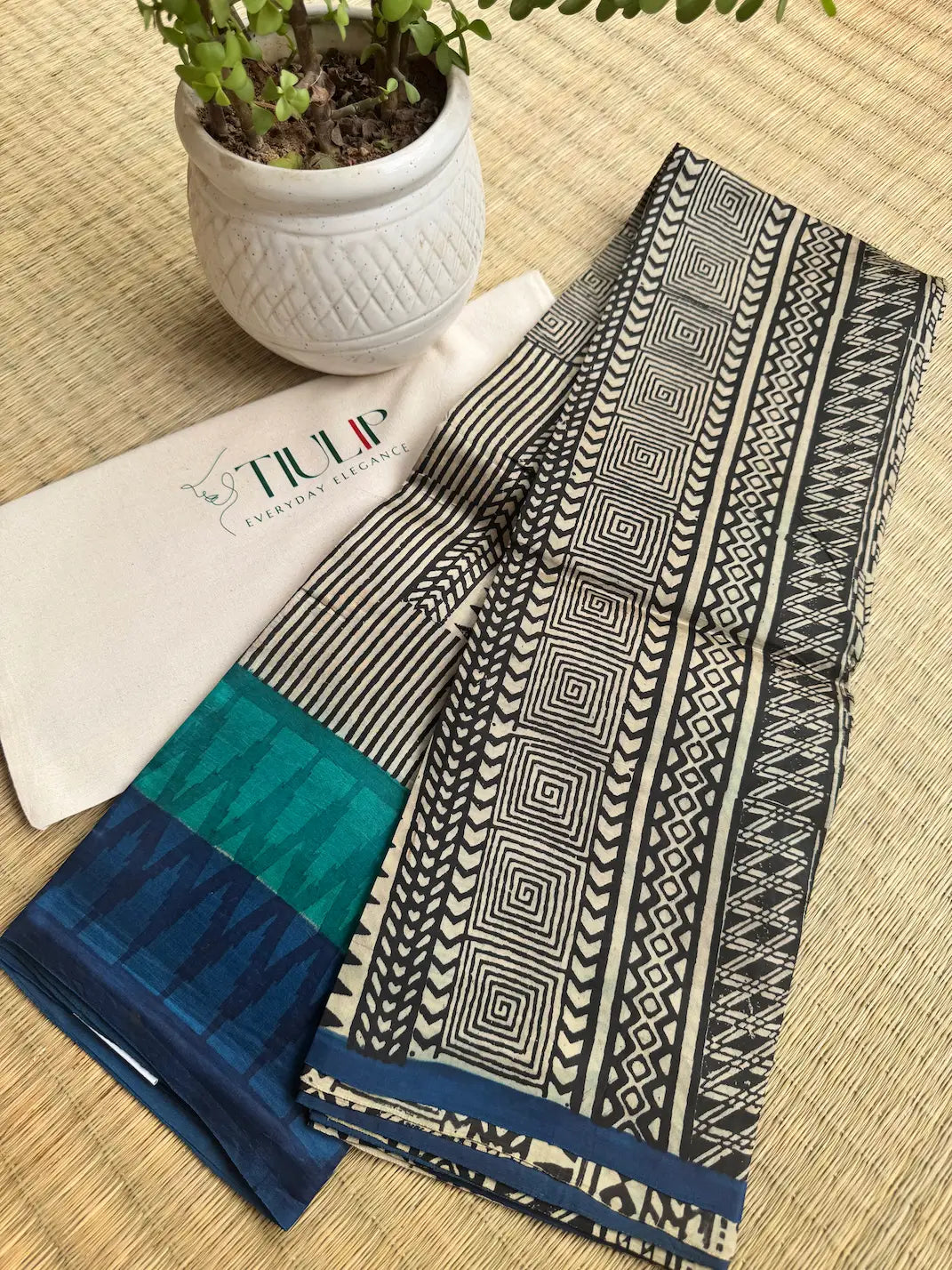 Vanashree pure handwoven green and black Murshidabad silk saree with elegant geometric woven design, natural silk lustre, and graceful drape for festive occasions