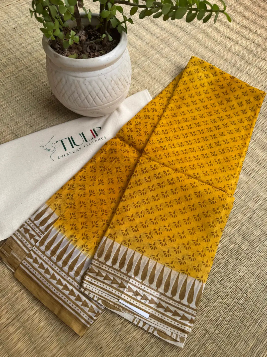 Hiranmayi pure handwoven yellow Murshidabad silk saree with a natural silk lustre and elegant drape for weddings, festive occasions, and celebrations