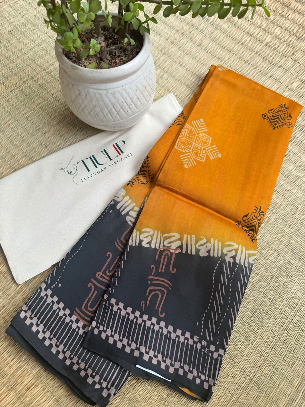 Kaushiki pure handwoven orange and black Murshidabad silk saree with a natural silk lustre and elegant drape for weddings, Durga Puja, and festive occasions