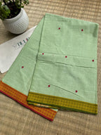 Pallabini pista green handwoven Dhaniakhali cotton saree from Bengal with a soft lightweight and breathable drape