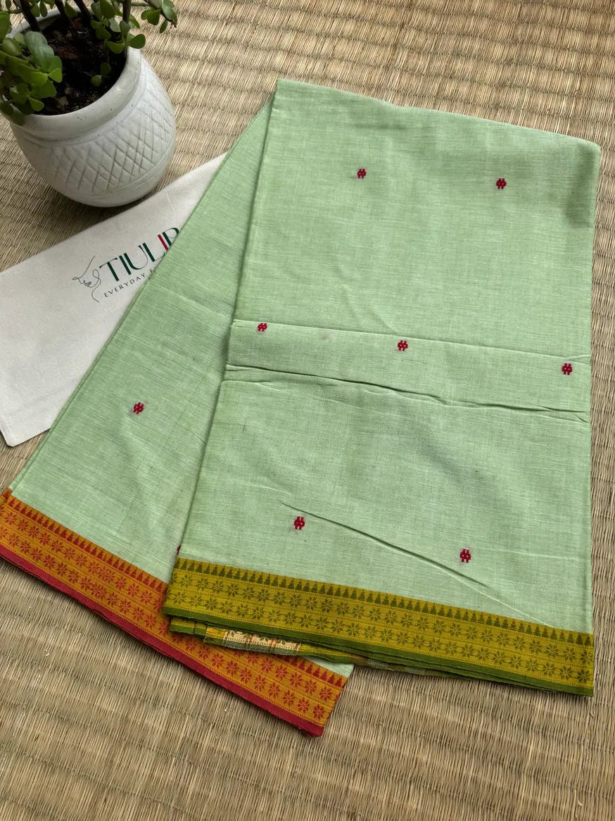 Pallabini pista green handwoven Dhaniakhali cotton saree from Bengal with a soft lightweight and breathable drape