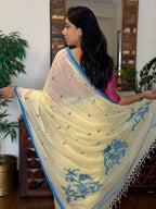 Woman wearing white handwoven cotton Jamdani saree with traditional motifs