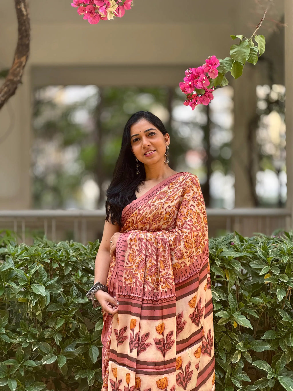 Woman wearing handwoven modal silk saree with elegant woven motifs