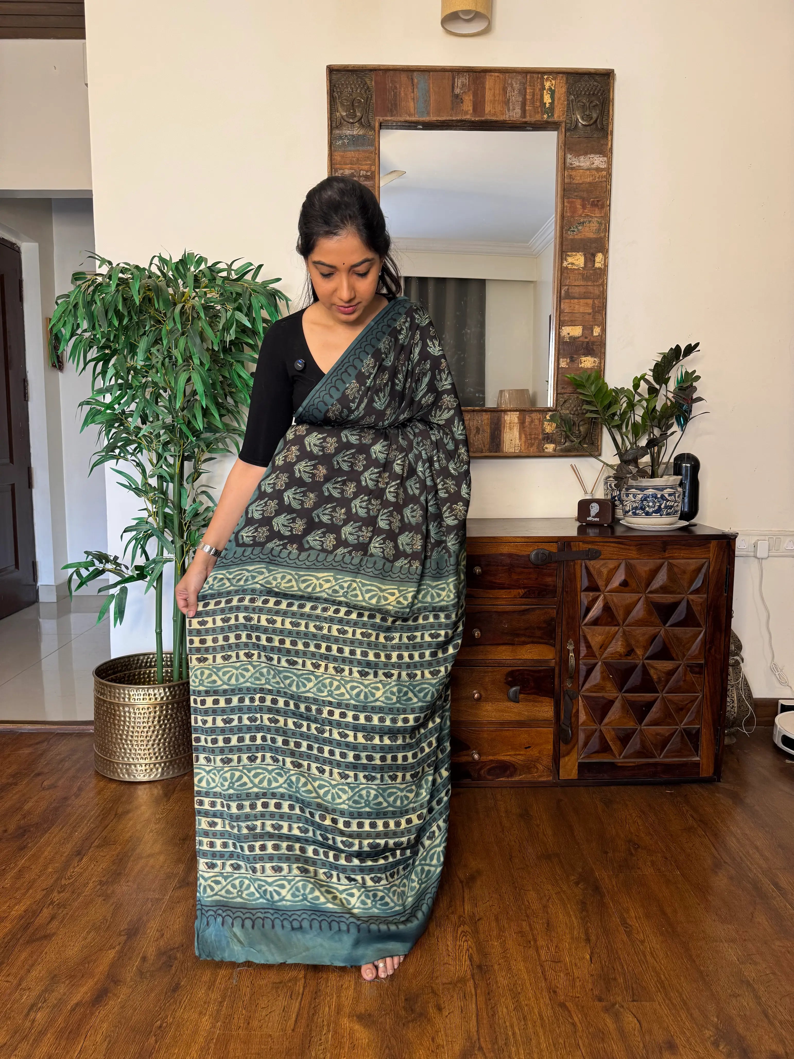 Woman wearing handwoven modal silk saree with elegant woven motifs